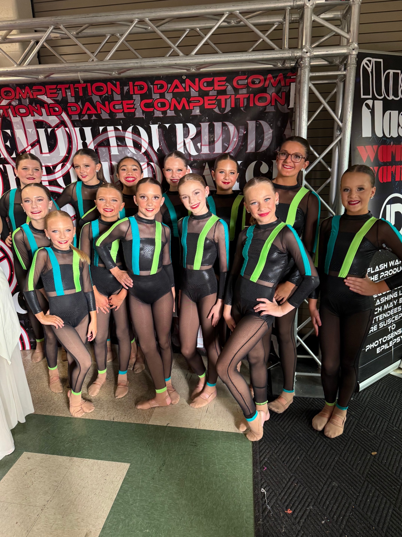 Team in black and neon costumes