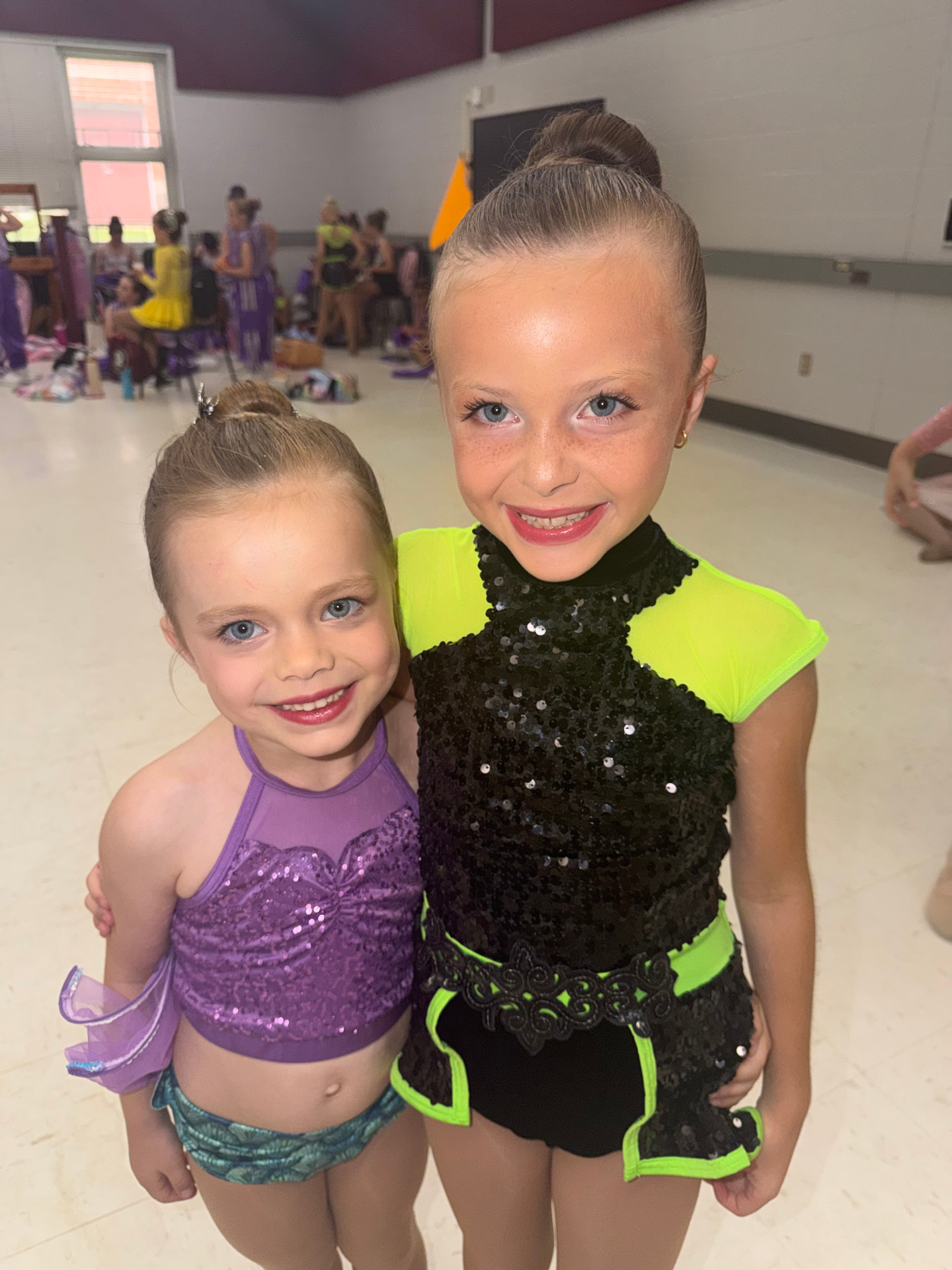 Two young dancers backstage